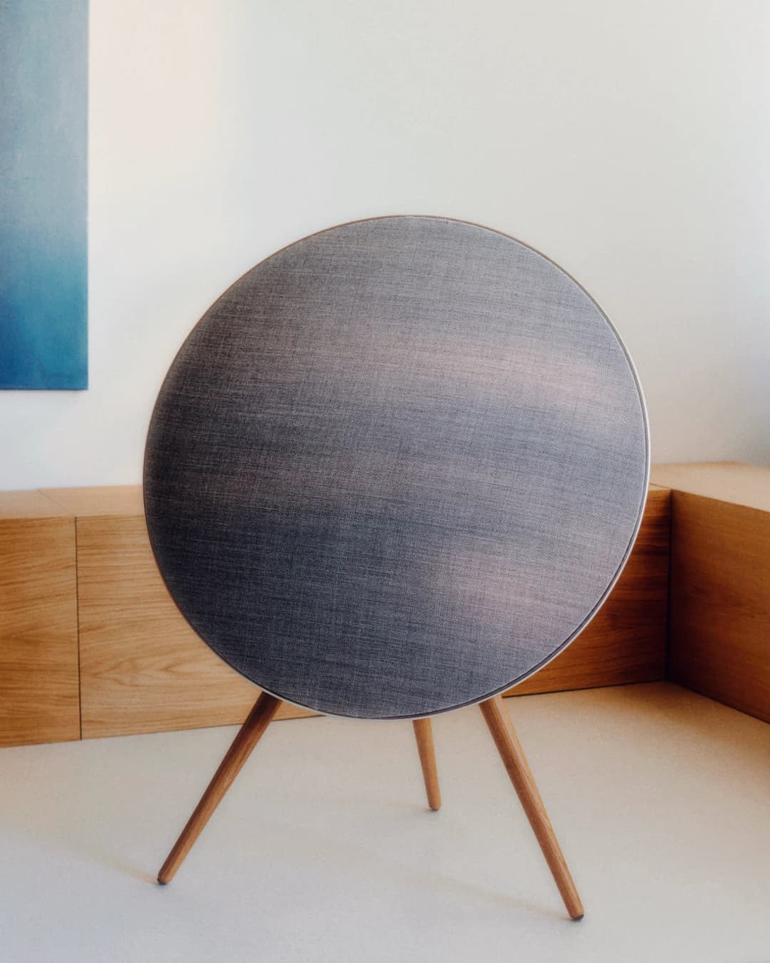 The A9 is a very flexible design. Most people know it standing on the three wooden legs, but you can also hang it on the wall where it can blend in if you take a fabric with the same color as a background to the wall or you can make it stand out by giving it another maybe contrasting color on the front fabric and the cool thing is they can always later on change their entire appearance of the design by changing the color of the front fabric. In this way, the appearance will change but the circle will always stay a circle and the A9 always stay an A9.